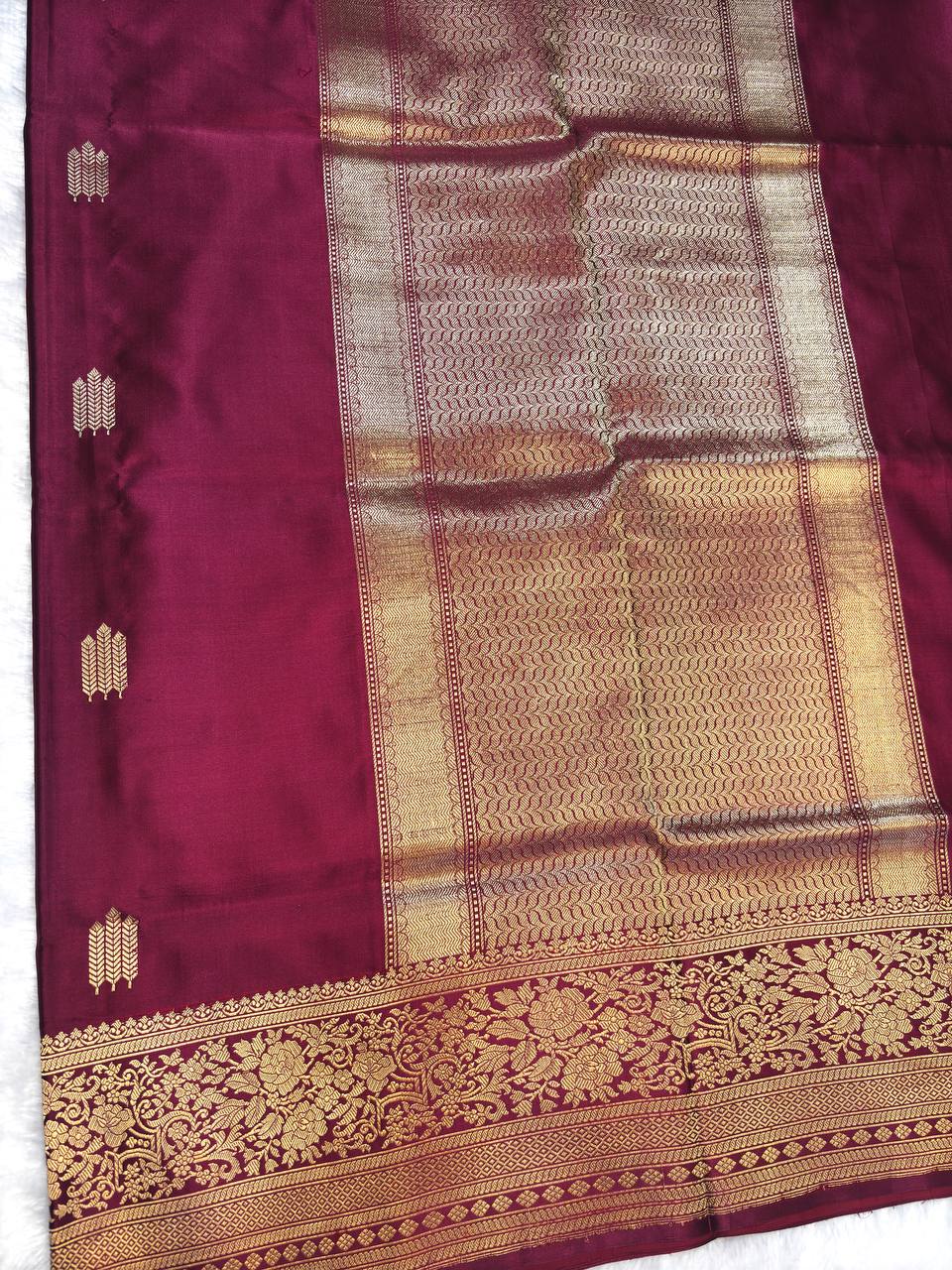 Wine Maroon Mashru Silk Saree with Arrowhead Buti and Elaborate Floral Zari Border