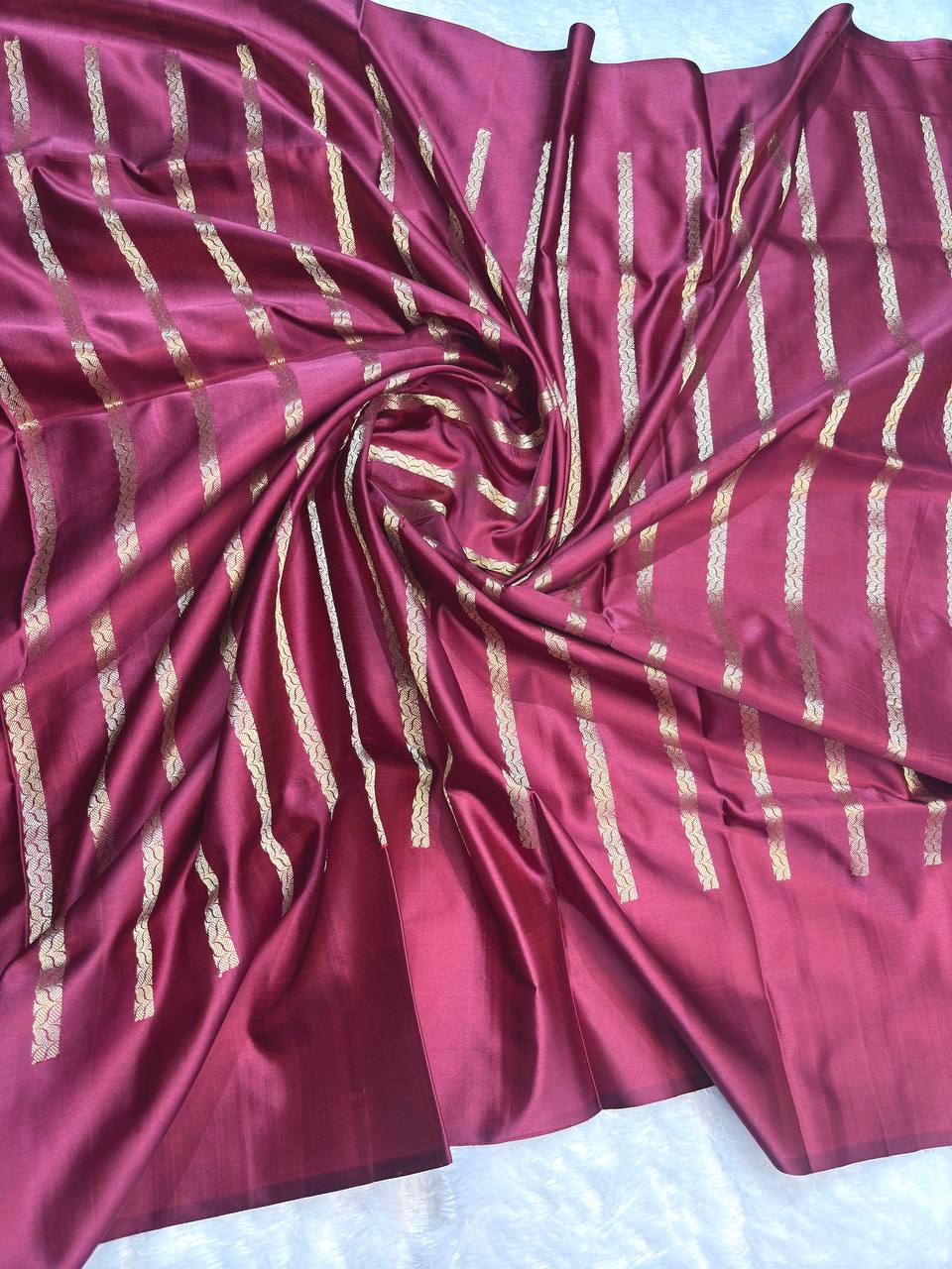 Wine Maroon Mashru Silk Saree with Arrowhead Buti and Elaborate Floral Zari Border