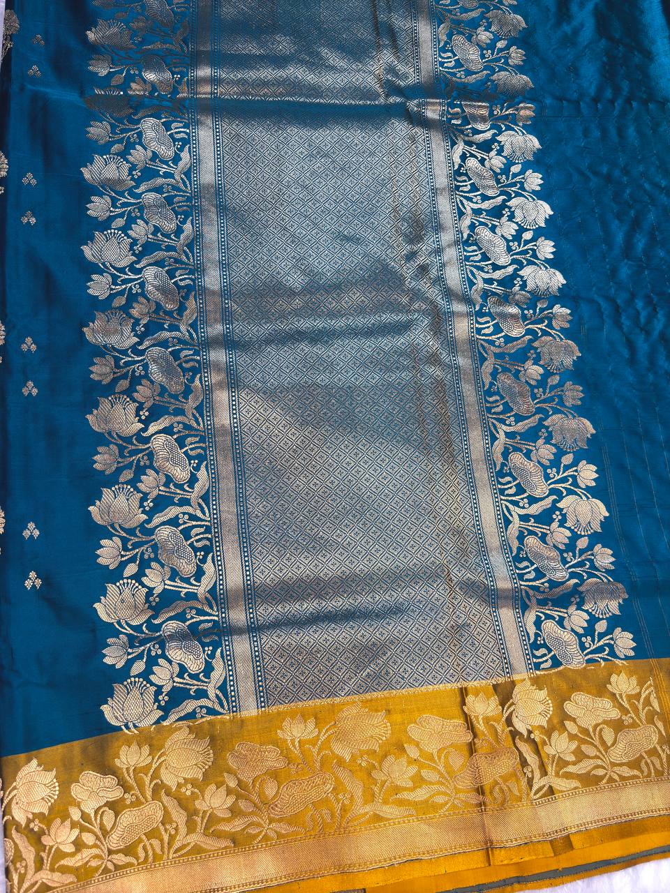 Peacock Blue Mashru Silk Saree with Mustard Contrast Floral Border and Silver-Gold Buta