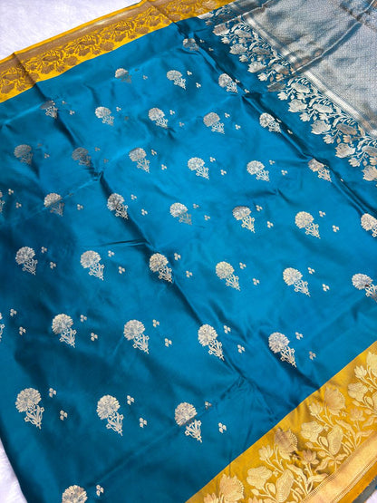 Peacock Blue Mashru Silk Saree with Mustard Contrast Floral Border and Silver-Gold Buta