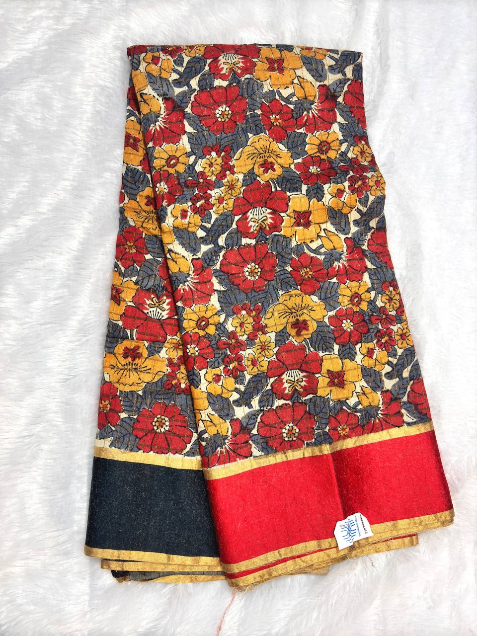 Bold Off-White Tussar Silk Saree with Dense Red and Mustard Kalamkari Floral Patterns and Striated Zari Pallu