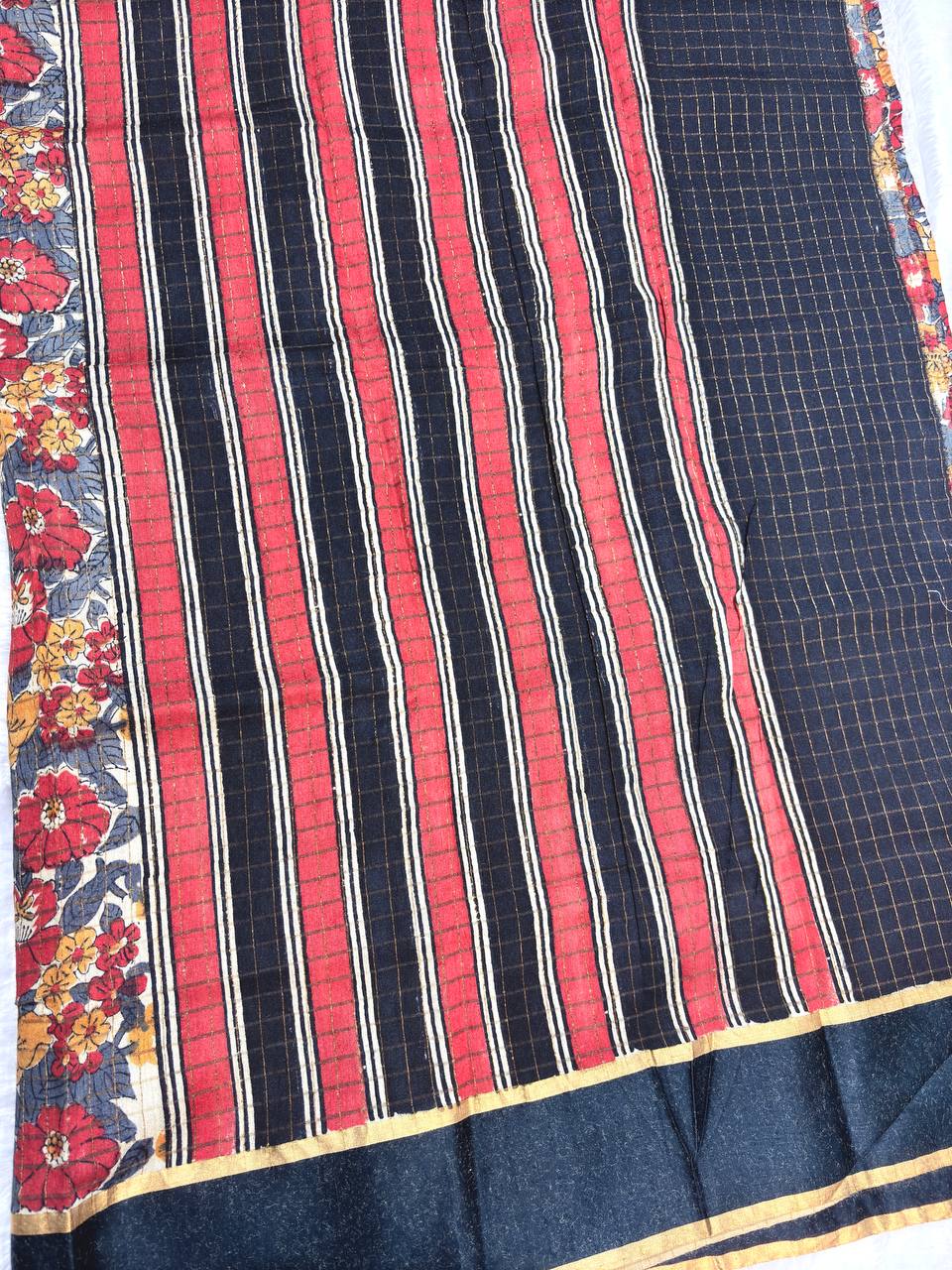 Bold Off-White Tussar Silk Saree with Dense Red and Mustard Kalamkari Floral Patterns and Striated Zari Pallu